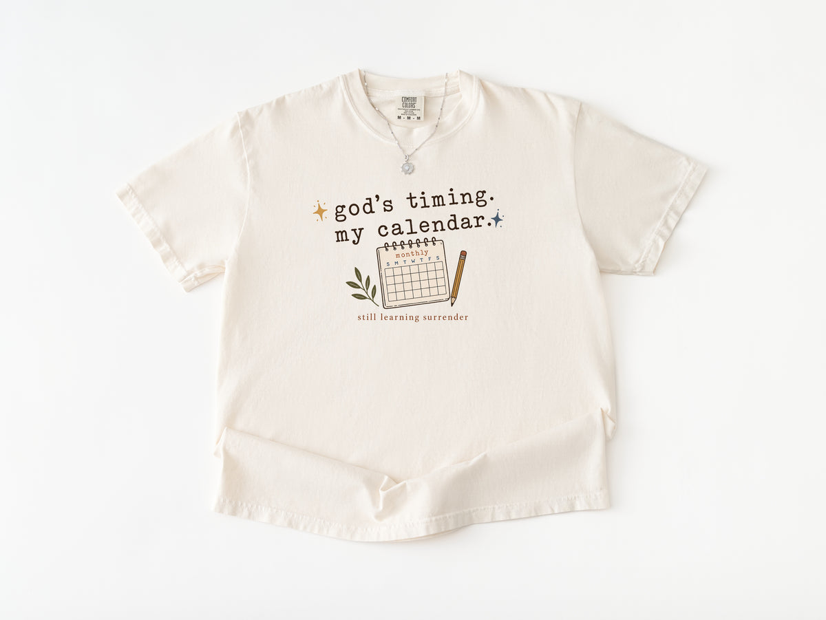 God's Timing My Calendar Catholic t-shirt for women, Ivory Comfort Colors tee — Cherished by Grace